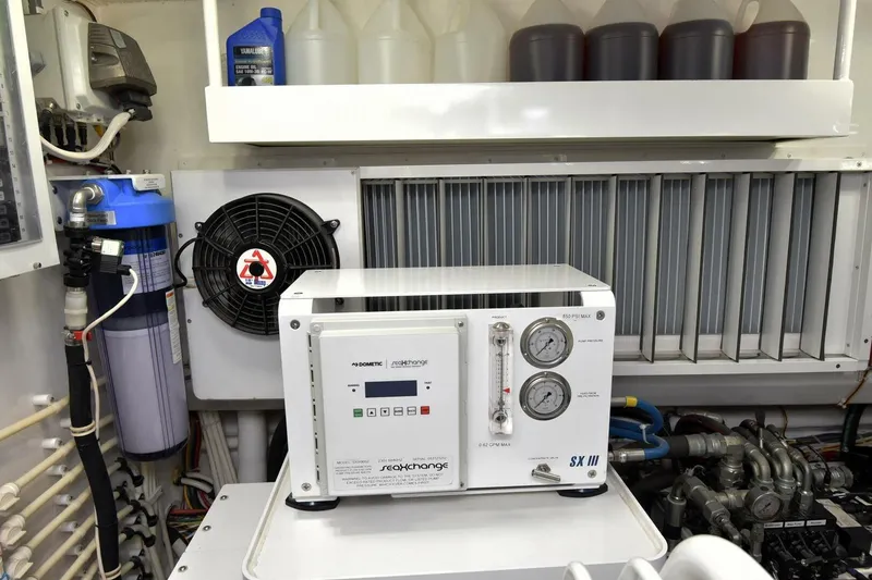 Slide: The Image of Engine room of 2019 Viking 80 Sky Bridge yacht with water filtration system. - 114