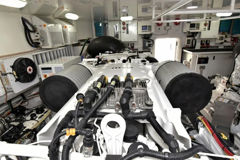 Slide: The Image of Engine room of 2019 Viking 80 Sky Bridge yacht, showcasing advanced machinery and components. - 115