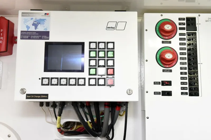Slide: The Image of Control panel on a 2019 Viking 80 Sky Bridge yacht, featuring switches and display. - 125