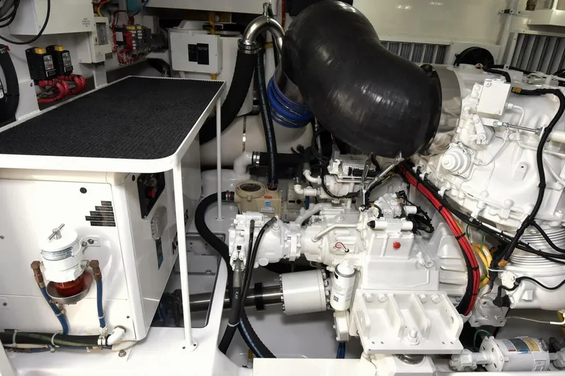 Slide: The Image of Engine room of 2019 Viking 80 Sky Bridge yacht, showcasing mechanical components and systems. - 126