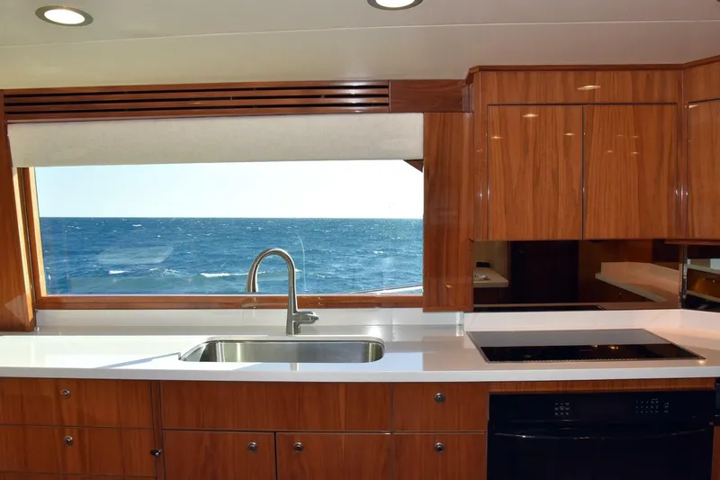 Slide: The Image of Luxurious kitchen interior of 2019 Viking 80 Sky Bridge yacht with ocean view. - 15
