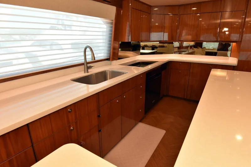 Slide: The Image of Luxurious kitchen interior of 2019 Viking 80 Sky Bridge yacht with sleek countertops. - 16