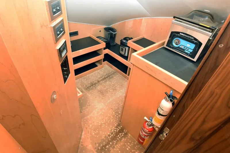 Slide: The Image of 2019 Viking 80 Sky Bridge yacht interior with appliances and safety equipment. - 22