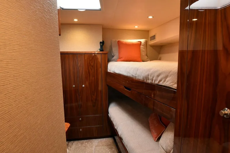 Slide: The Image of Luxurious cabin interior of 2019 Viking 80 Sky Bridge yacht with bunk beds. - 29