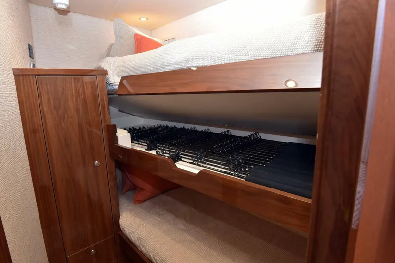 Slide: The Image of Bunk beds with storage in 2019 Viking 80 Sky Bridge yacht interior. - 33