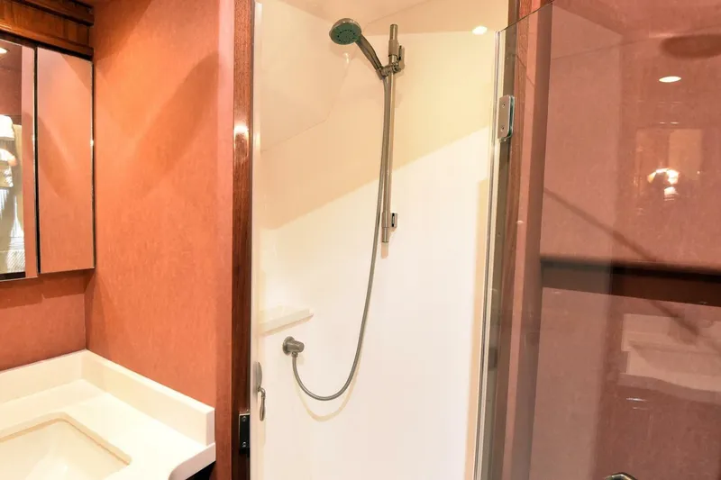 Slide: The Image of Luxurious bathroom in 2019 Viking 80 Sky Bridge yacht with modern shower design. - 37