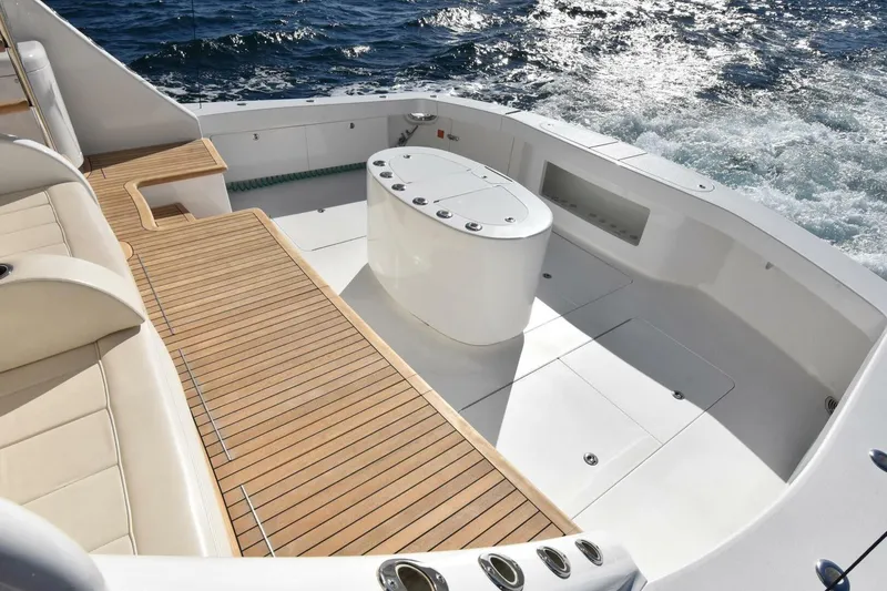 Slide: The Image of Luxurious deck of 2019 Viking 80 Sky Bridge yacht with teak flooring and ocean view. - 4