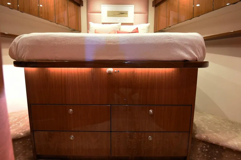 Slide: The Image of Luxurious bedroom interior of 2019 Viking 80 Sky Bridge yacht with elegant wood finish. - 41