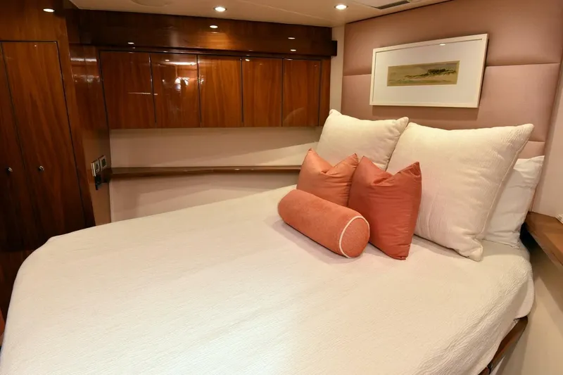 Slide: The Image of Luxurious bedroom interior on 2019 Viking 80 Sky Bridge yacht with elegant wood finishes. - 42