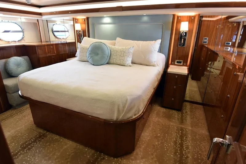 Slide: The Image of Luxurious bedroom interior of 2019 Viking 80 Sky Bridge yacht with elegant wood finishes. - 43