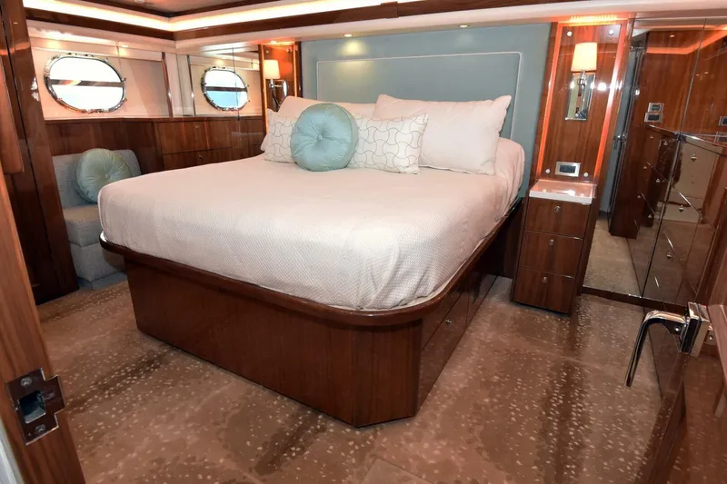Slide: The Image of Luxurious bedroom interior of 2019 Viking 80 Sky Bridge yacht with elegant wood finishes. - 45