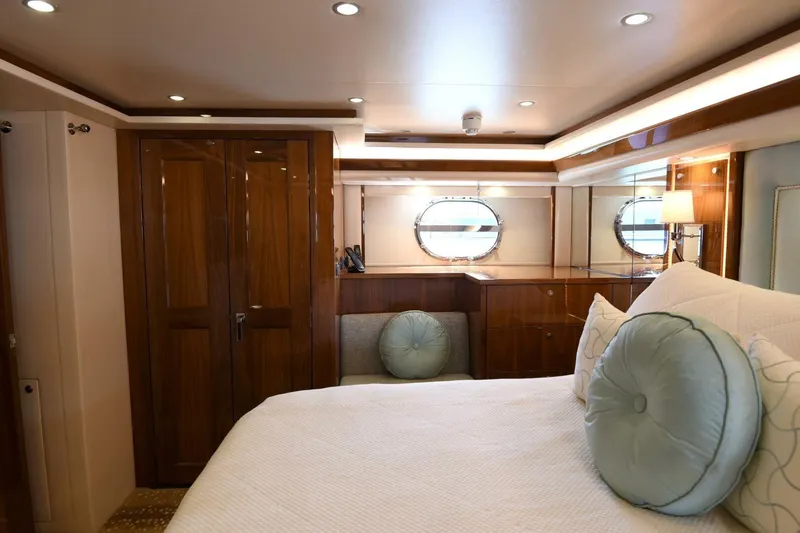 Slide: The Image of Luxurious bedroom interior of 2019 Viking 80 Sky Bridge yacht with elegant wood finishes. - 48