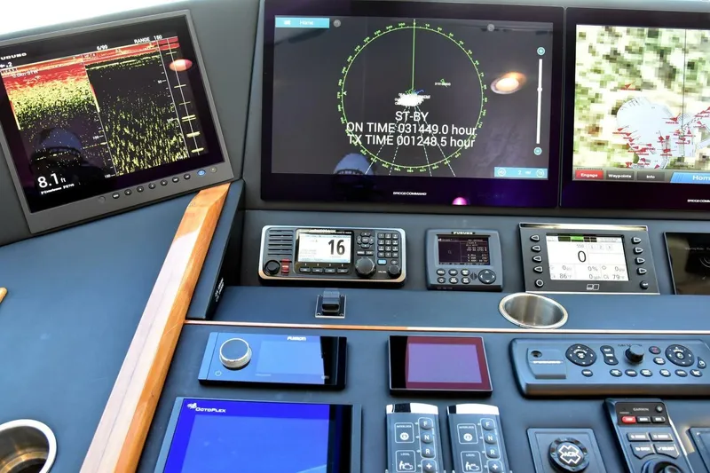 Slide: The Image of Control panel of 2019 Viking 80 Sky Bridge yacht with advanced navigation displays. - 58