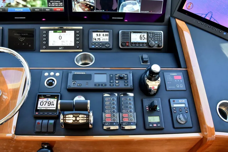 Slide: The Image of Control panel of 2019 Viking 80 Sky Bridge yacht with advanced navigation instruments. - 59