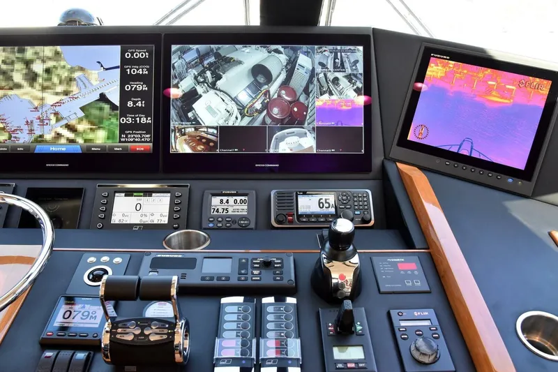 Slide: The Image of Control panel of a 2019 Viking 80 Sky Bridge yacht with navigation and monitoring screens. - 60