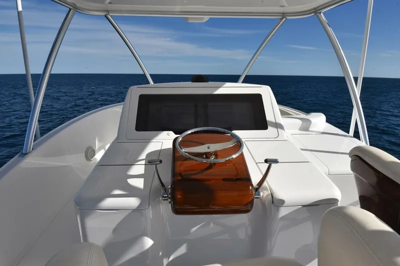 Slide: The Image of 2019 Viking 80 Sky Bridge yacht helm with ocean view. - 69