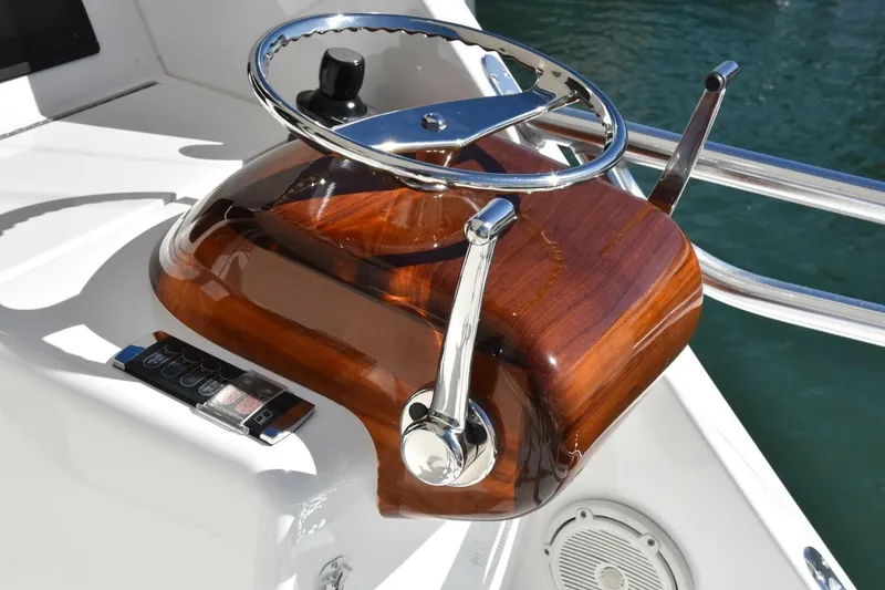 Slide: The Image of Steering wheel and controls of 2019 Viking 80 Sky Bridge yacht. - 71