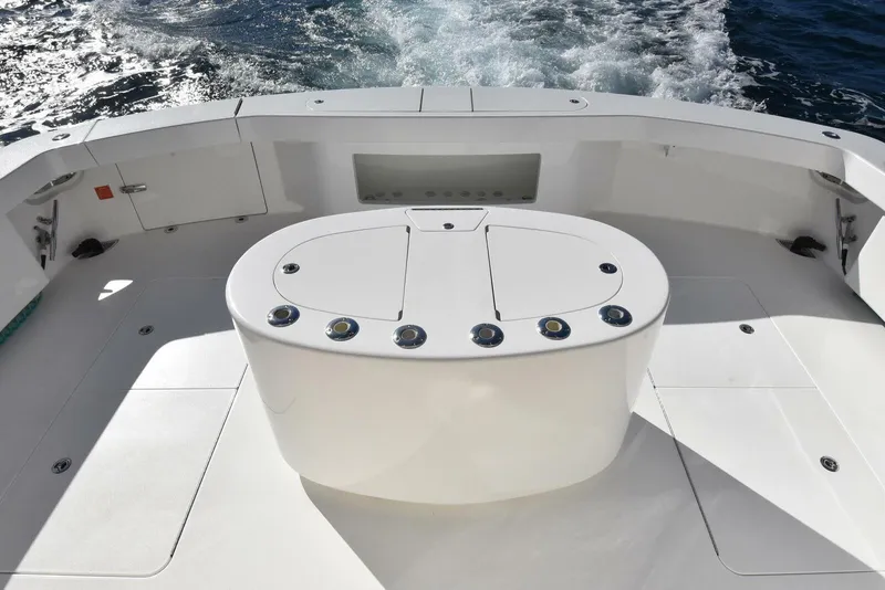 Slide: The Image of 2019 Viking 80 Sky Bridge yacht deck with ocean view and sleek design. - 92