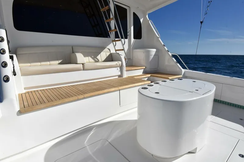 Slide: The Image of Luxurious 2019 Viking 80 Sky Bridge yacht deck with seating and ocean view. - 95