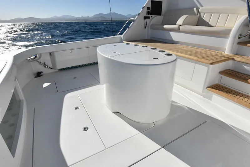 Slide: The Image of Luxurious 2019 Viking 80 Sky Bridge yacht deck with seating and ocean view. - 97