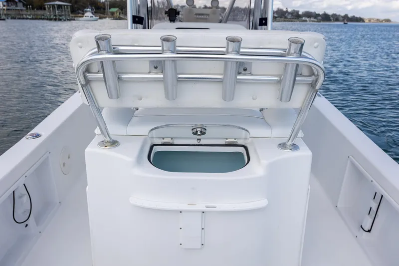 Slide: The Image of 2015 Sea Hunt BX 22 Pro boat interior with rod holders and livewell. - 10