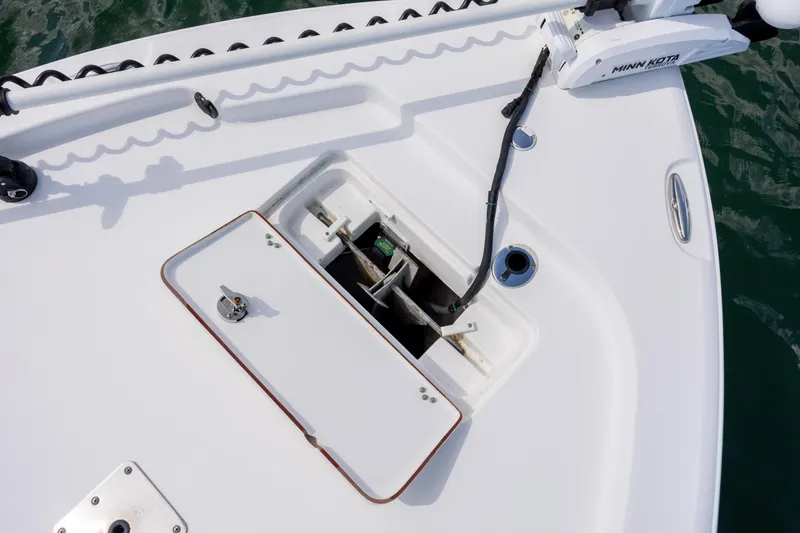 Slide: The Image of 2015 Sea Hunt BX 22 Pro boat deck with anchor storage and Minn Kota trolling motor. - 12