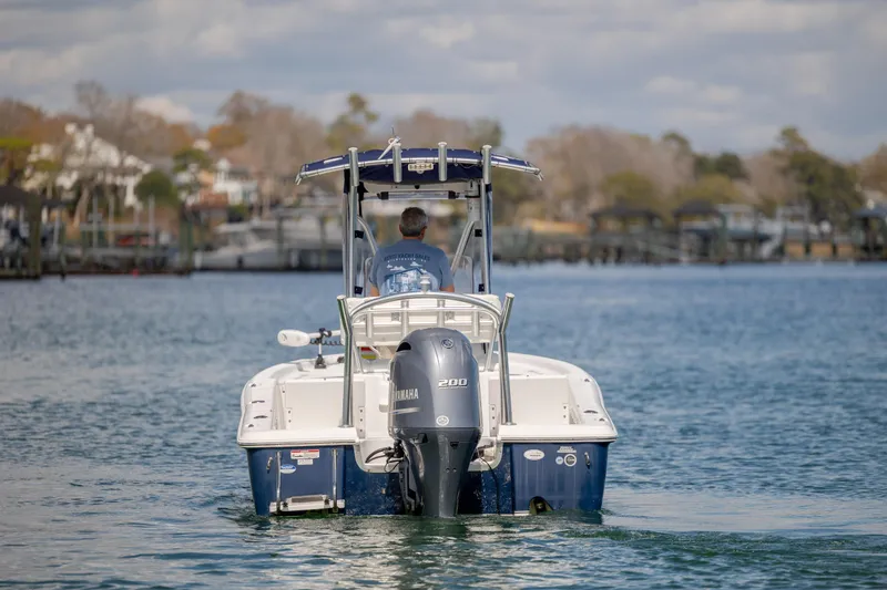 Slide: The Image of 2015 Sea Hunt BX 22 Pro boat on water, rear view with Yamaha engine. - 14