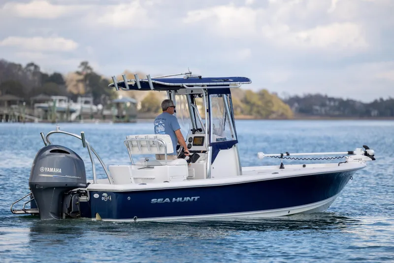 Slide: The Image of 2015 Sea Hunt BX 22 Pro boat on water with Yamaha engine. - 3