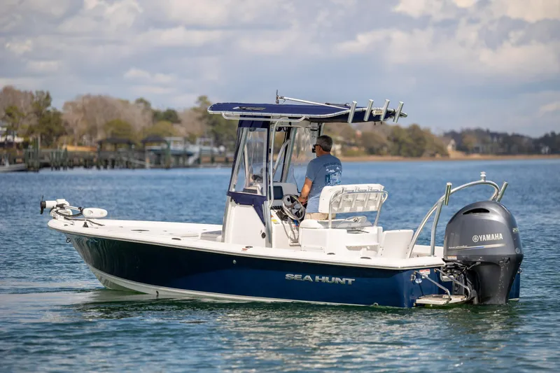 Slide: The Image of 2015 Sea Hunt BX 22 Pro boat on calm water with Yamaha engine. - 4