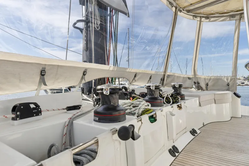 Slide: The Image of 2022 Lagoon 52 F yacht deck with winches and seating area. - 10