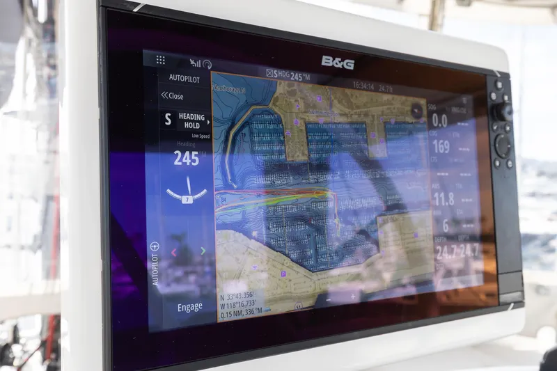 Slide: The Image of Navigation display on a 2022 Lagoon 52 F yacht, showing autopilot and map details. - 17
