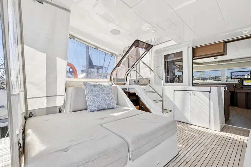 Slide: The Image of Luxurious interior of 2022 Lagoon 52 F catamaran with modern furnishings and spacious layout. - 21