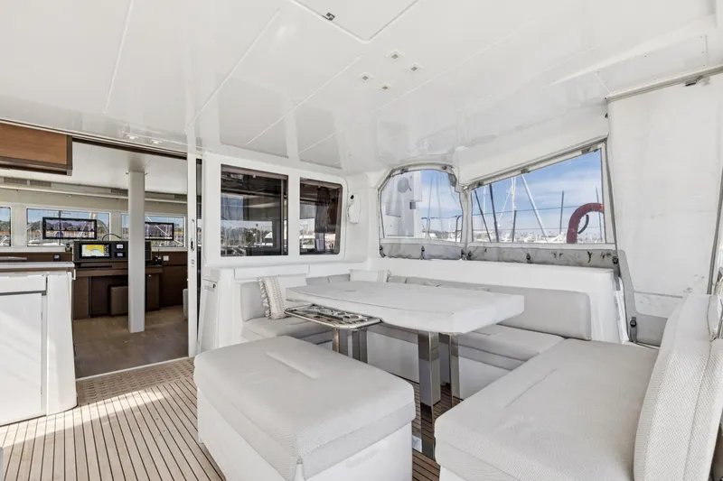 Slide: The Image of Luxurious interior of 2022 Lagoon 52 F catamaran with spacious seating and modern design. - 25