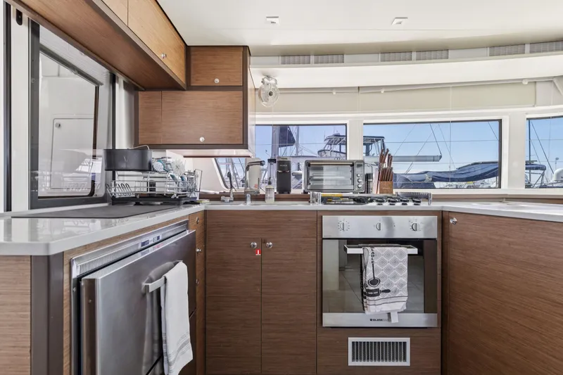 Slide: The Image of Modern kitchen interior on 2022 Lagoon 52 F yacht with appliances and ocean view. - 30