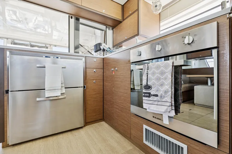 Slide: The Image of Modern kitchen in 2022 Lagoon 52 F yacht with stainless steel appliances. - 33