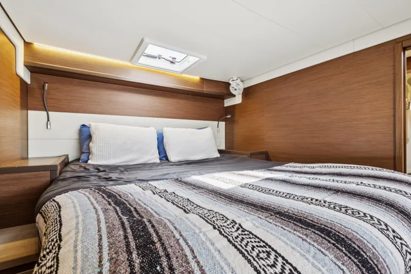 Slide: The Image of Luxurious cabin interior of 2022 Lagoon 52 F yacht with cozy bedding. - 37