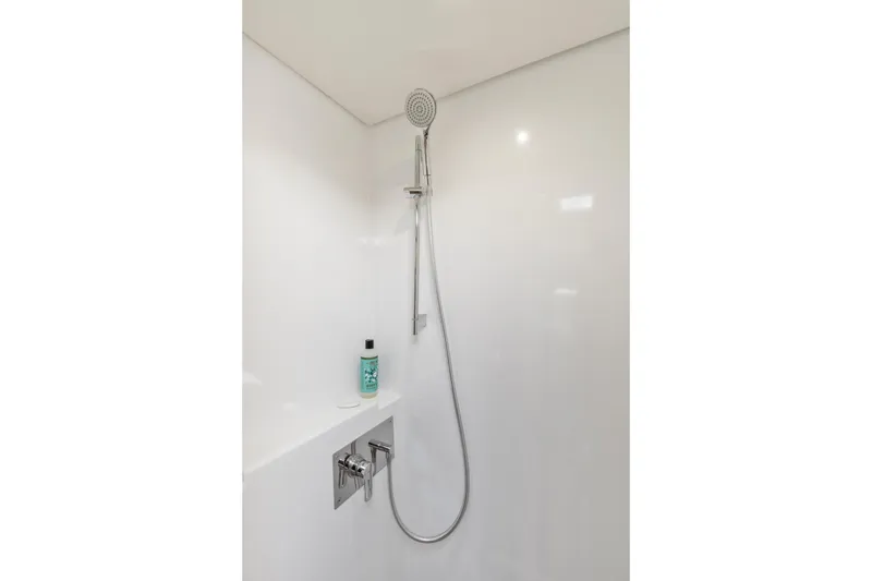 Slide: The Image of Modern shower in 2022 Lagoon 52 F yacht, featuring sleek design and chrome fixtures. - 40