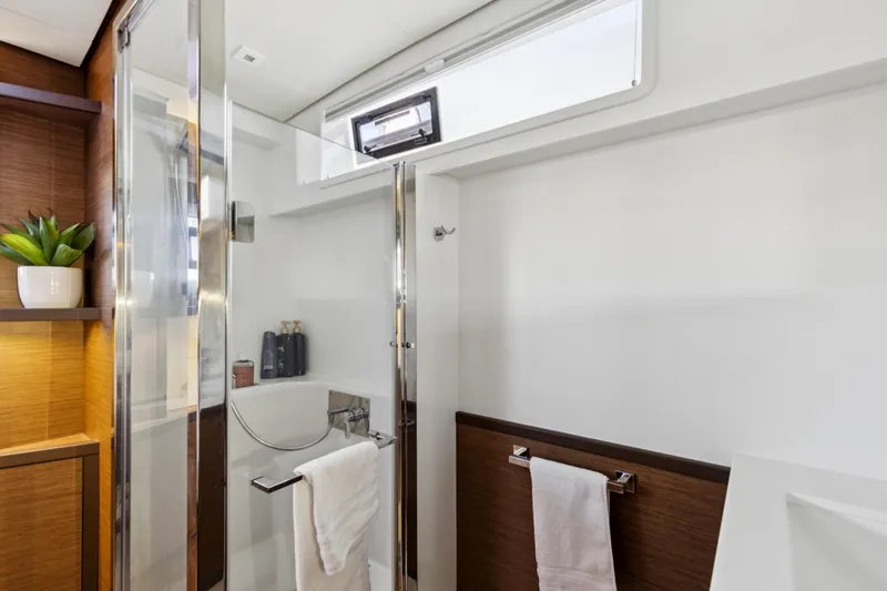Slide: The Image of Modern bathroom interior on 2022 Lagoon 52 F yacht, featuring sleek design and elegant fixtures. - 46
