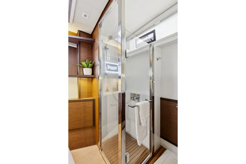 Slide: The Image of Luxurious bathroom interior of 2022 Lagoon 52 F yacht with modern shower and wooden accents. - 47