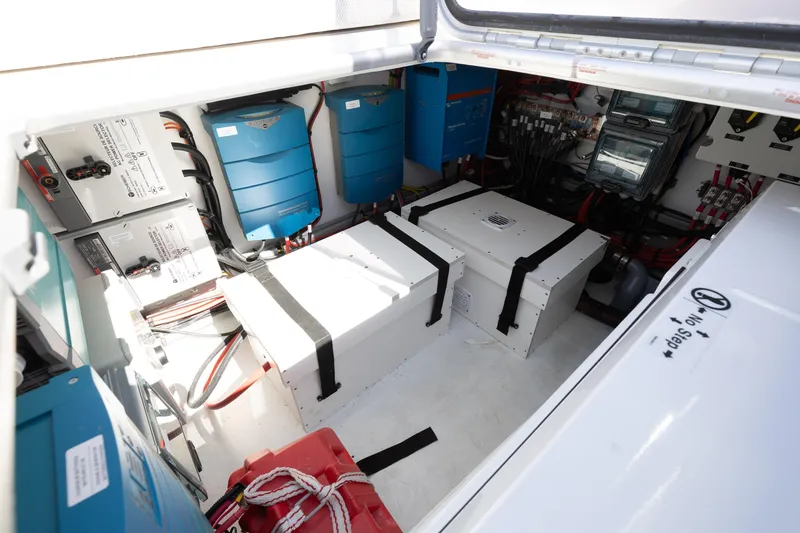 Slide: The Image of Electrical compartment of 2022 Lagoon 52 F yacht with batteries and wiring systems. - 61