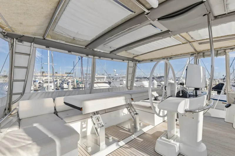 Slide: The Image of Interior view of 2022 Lagoon 52 F yacht with helm and seating area. - 7