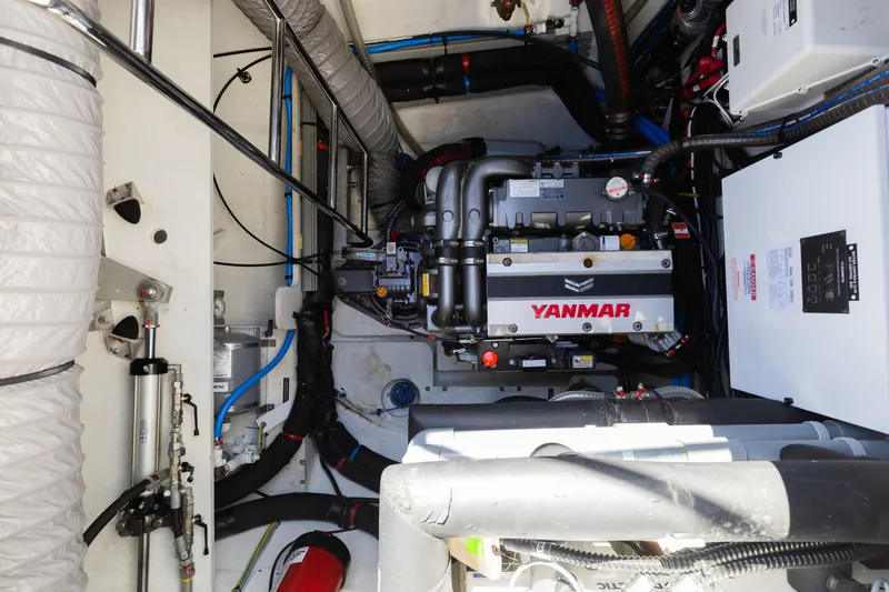 Slide: The Image of Engine room of 2022 Lagoon 52 F yacht featuring Yanmar engine components. - 70