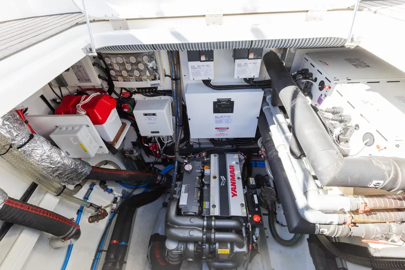 Slide: The Image of Engine room of 2022 Lagoon 52 F yacht with Yanmar engine and electrical components. - 71