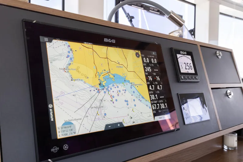 Slide: The Image of Navigation system on 2022 Lagoon 52 F yacht, displaying nautical chart and data. - 74