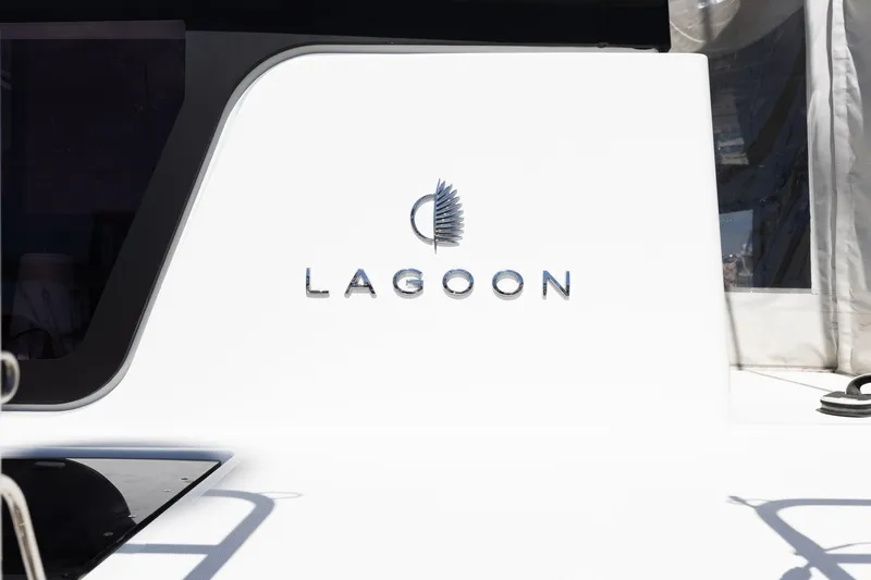 Slide: The Image of 2022 Lagoon 52 F yacht logo on sleek white surface. - 87