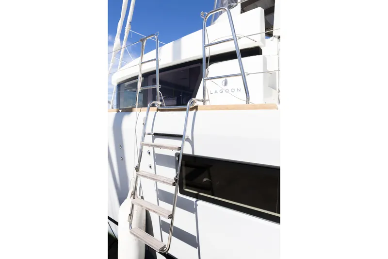 Slide: The Image of 2022 Lagoon 52 F yacht with stainless steel ladder and sleek design. - 88