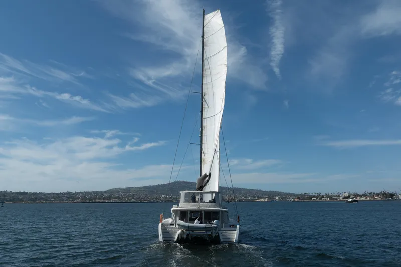 Slide: The Image of Sailing Lagoon 52 F catamaran on open water, clear sky, 2022 model. - 95