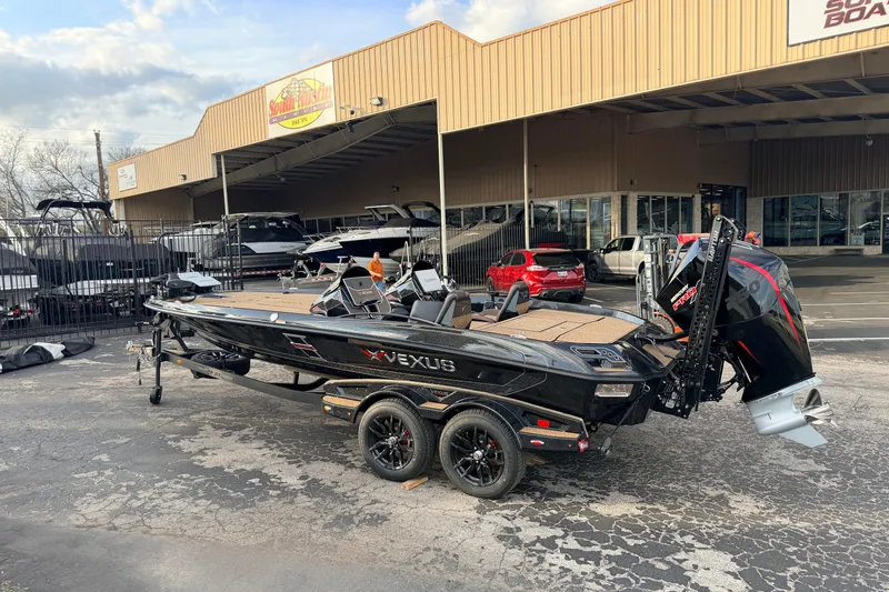 The Image of 2026 Vexus VXs21 boat parked outside a dealership, showcasing sleek design and powerful engine. - 0