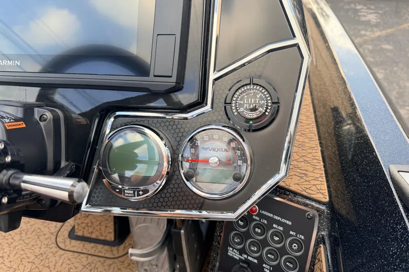 Slide: The Image of Dashboard of 2026 Vexus VXs21 boat with gauges and controls. - 12