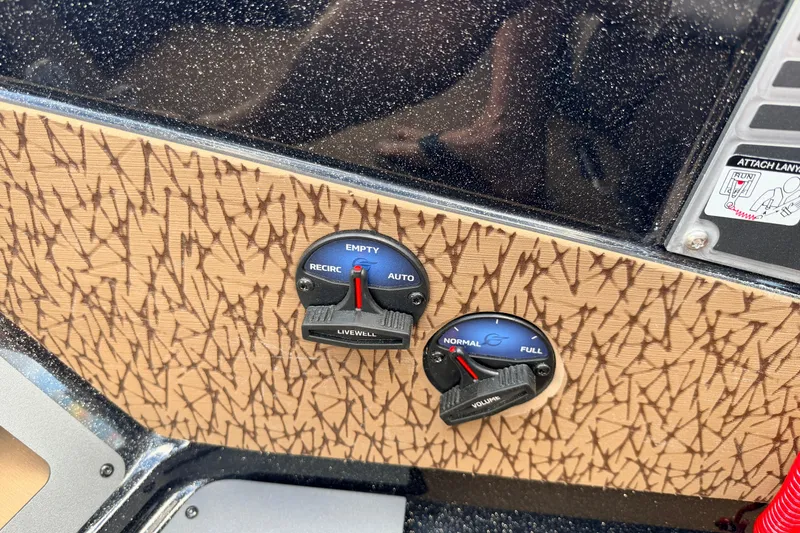 Slide: The Image of Control panel of 2026 Vexus VXs21 boat with livewell and volume dials. - 14